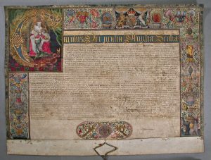The Letters Patent of Charles I, granted to Queen's College in 1626, showing the border and illumination.