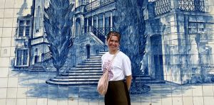 Emily Dicker pictured on her year abroad in front of a blue-tiled building