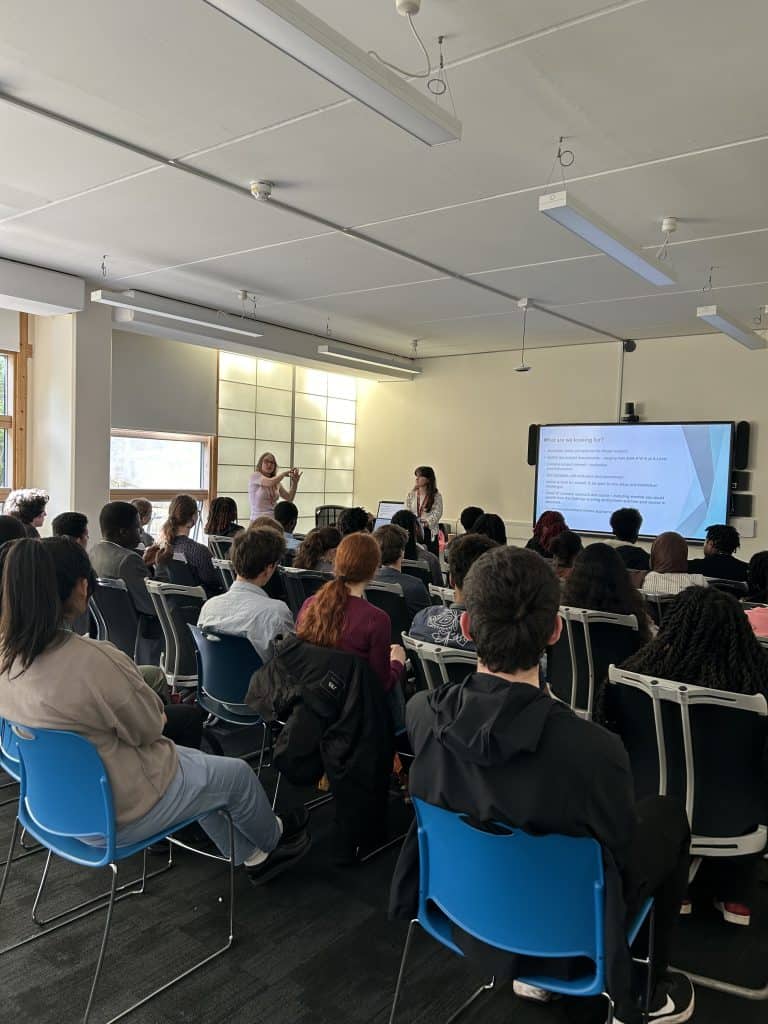 Outreach teams from Queen's and Gonville and Caius (Cambridge) talking to students from Lewisham as part of the Lewisham Challenge programme.