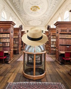the Upper Library at Queen's with a (superimposed) straw hat sitting on top of the Senex globe