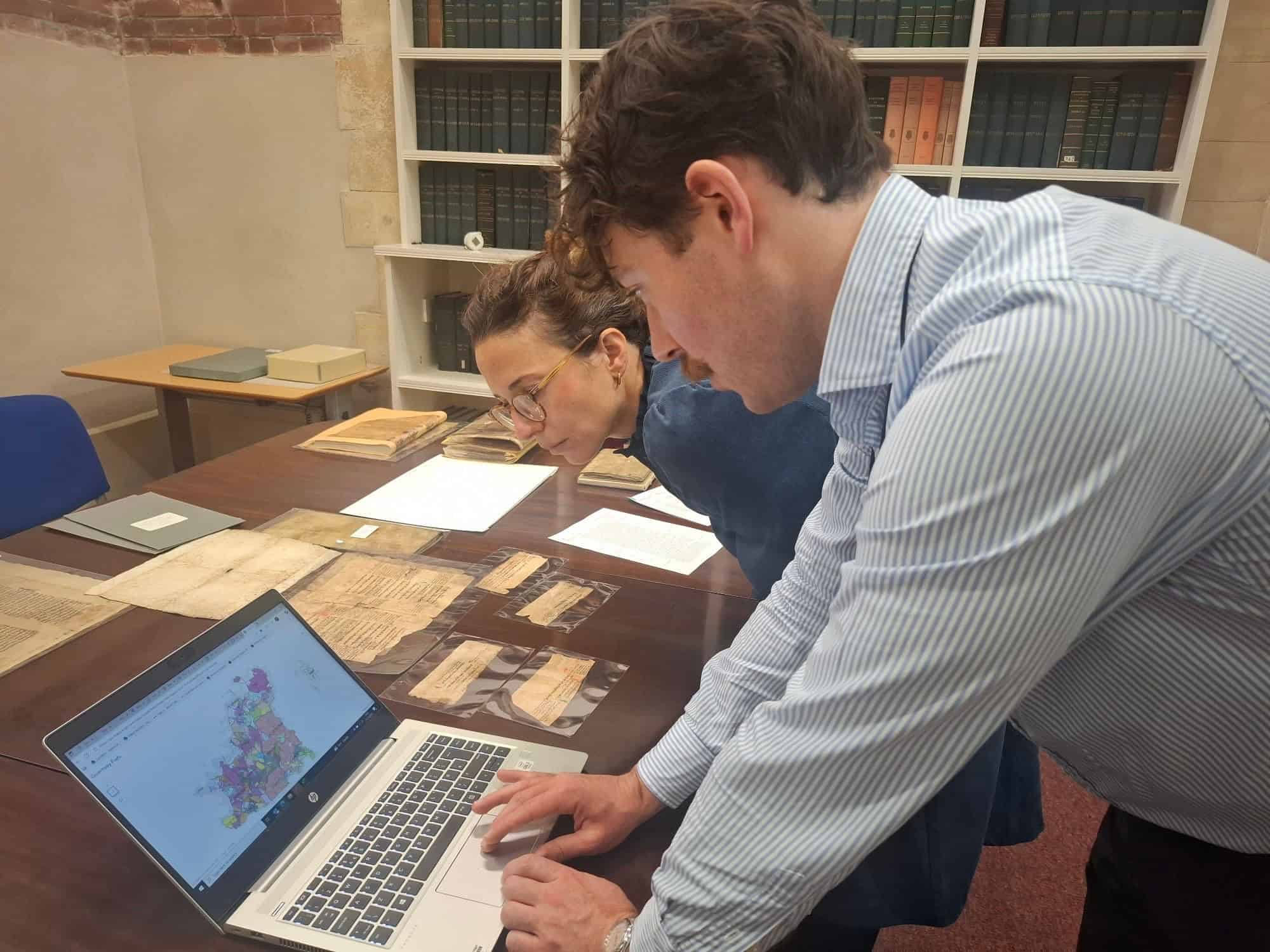 Prof Tamara Atkin and Callum Tostevin Hall, the Archives' Assistant who found the fragments on Guernsey. Photo taken by colleague Dr David Rundle